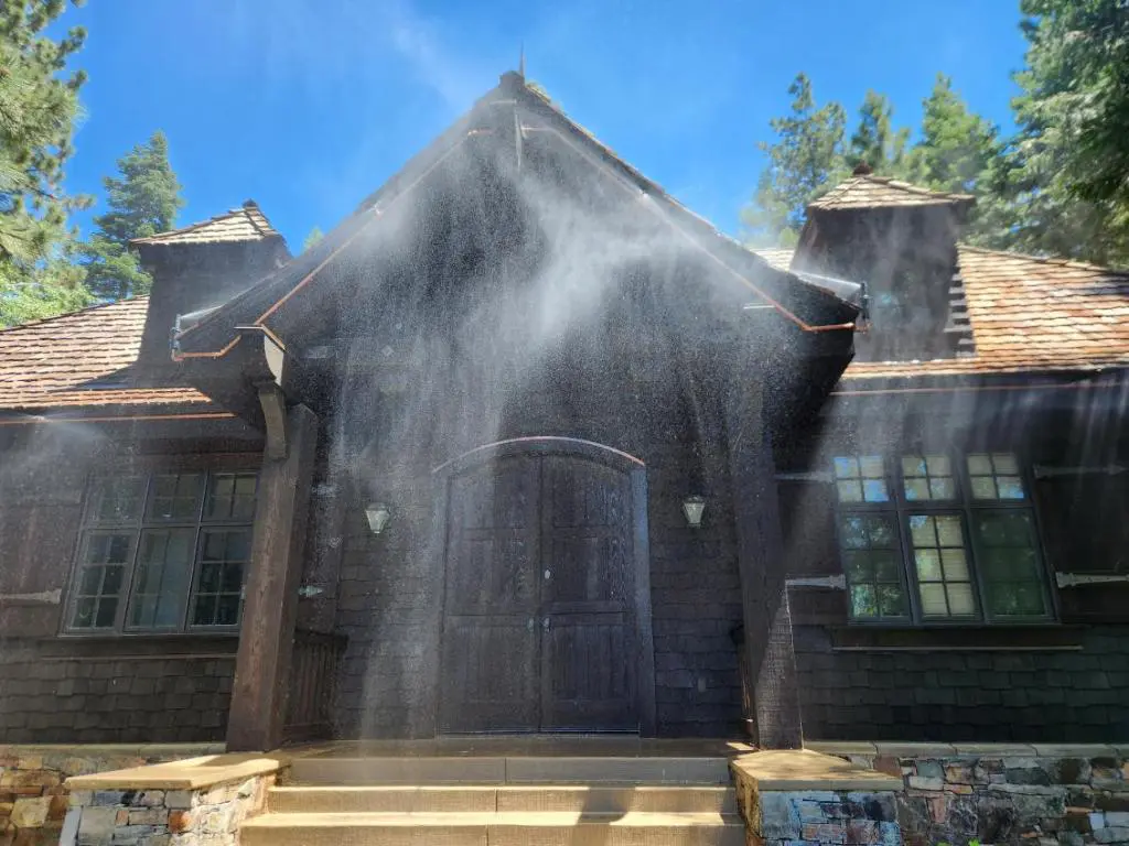 A house with smoke coming out of the top.